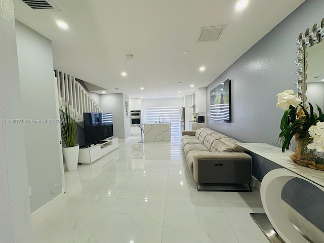 13729 SW 171st Ln, Miami, FL 33177 - living area featuring light marble finish flooring, recessed lighting, and stairway