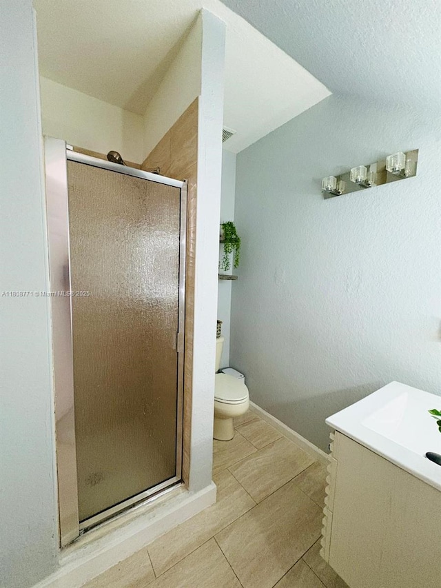 13729 SW 171st Ln, Miami, FL 33177 - full bathroom with toilet, a stall shower, vanity, tile patterned flooring, and baseboards