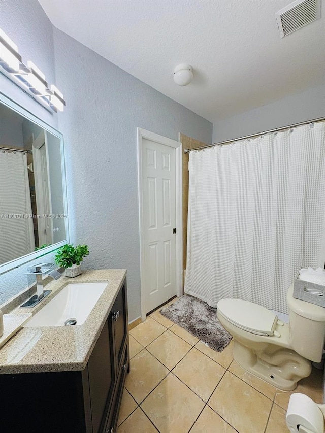 13729 SW 171st Ln, Miami, FL 33177 - full bath with toilet, vanity, a textured wall, tile patterned floors, and a textured ceiling