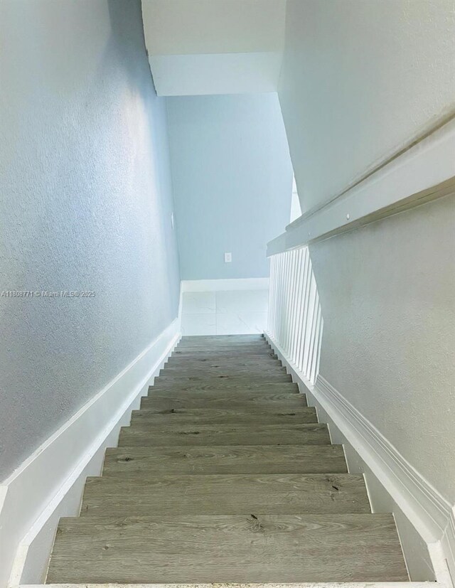 13729 SW 171st Ln, Miami, FL 33177 - staircase with baseboards