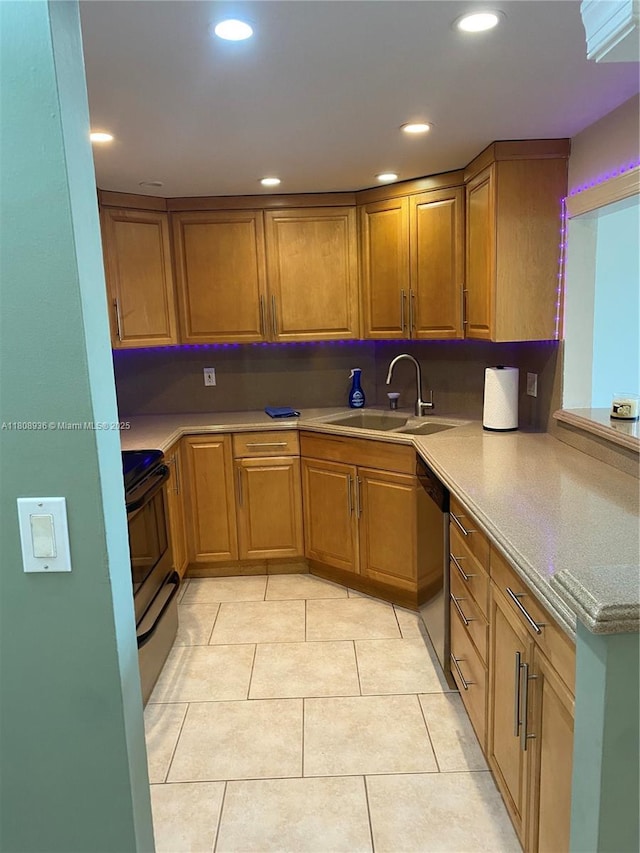 1424 SE 15th St Unit 45, Fort Lauderdale, FL 33316 - kitchen with electric range, a sink, dishwasher, brown cabinets, and recessed lighting