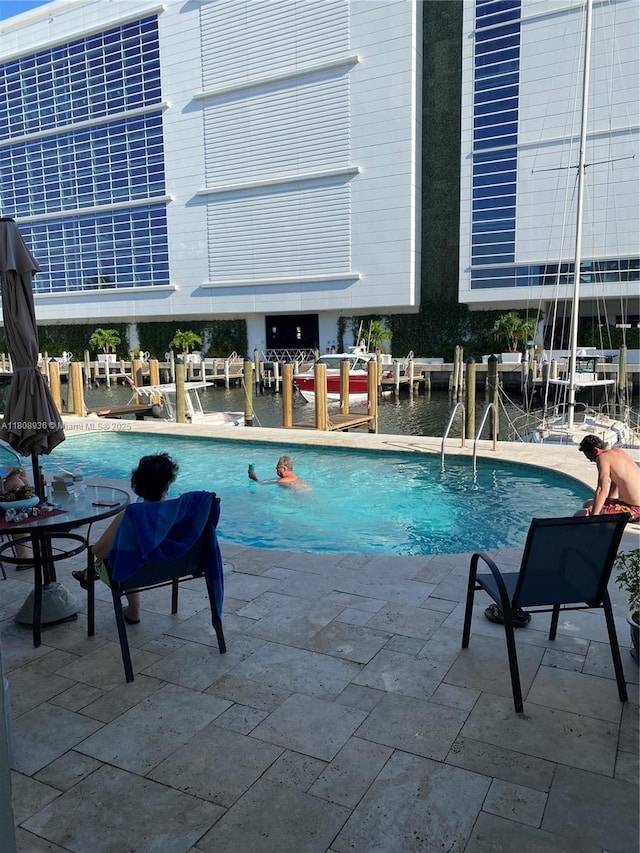 1424 SE 15th St Unit 45, Fort Lauderdale, FL 33316 - community pool featuring a water view and a patio