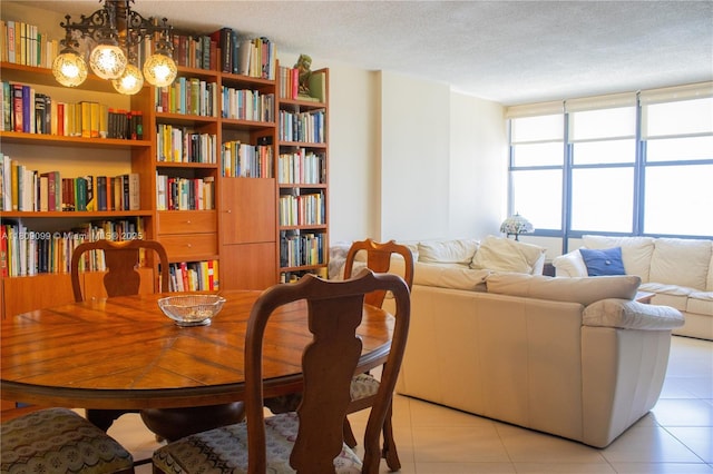 1865 Brickell Ave Unit A2111, Miami, FL 33129 - dining area featuring light tile patterned floors, a textured ceiling, and a chandelier