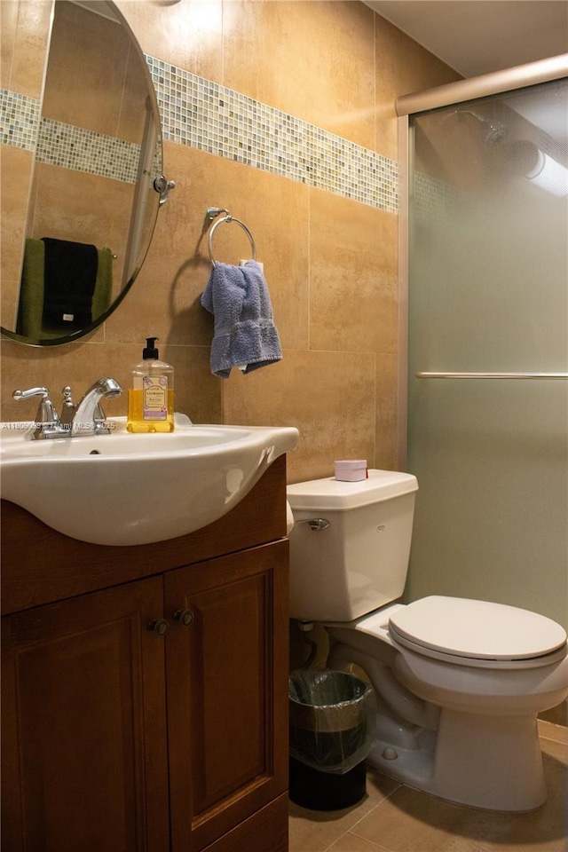 1865 Brickell Ave Unit A2111, Miami, FL 33129 - bathroom featuring vanity, toilet, a stall shower, and tile walls