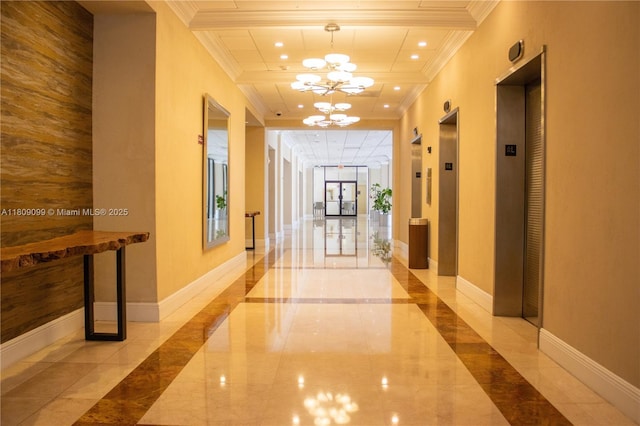 1865 Brickell Ave Unit A2111, Miami, FL 33129 - corridor with crown molding, a chandelier, recessed lighting, elevator, and inlaid floor details
