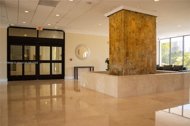 1865 Brickell Ave Unit A2111, Miami, FL 33129 - community lobby featuring crown molding, recessed lighting, and a wall of windows