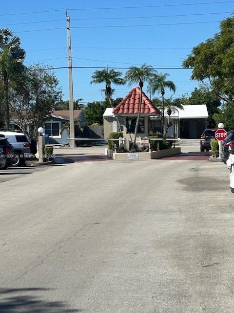 5326 NE 6th Ave Unit E23, Oakland Park, FL 33334 - view of street featuring traffic signs
