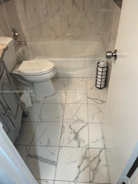 5326 NE 6th Ave Unit E23, Oakland Park, FL 33334 - full bath featuring marble look tile flooring, toilet, shower / bathtub combination, and vanity