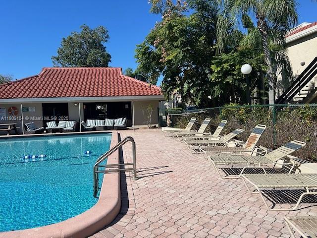 5326 NE 6th Ave Unit E23, Oakland Park, FL 33334 - community pool featuring a patio area