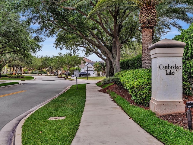 457 Cambridge Dr, Weston, FL 33326 - view of asphalt road featuring sidewalks, curbs, and traffic signs