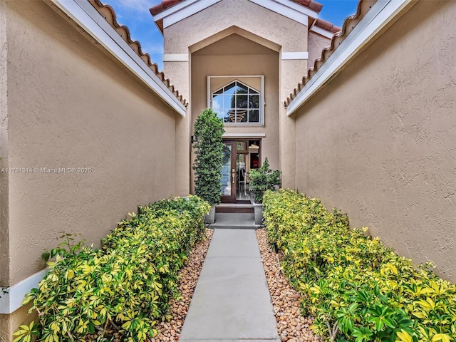457 Cambridge Dr, Weston, FL 33326 - property entrance with stucco siding and a tile roof