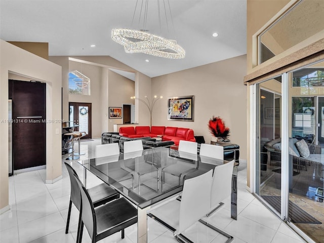 457 Cambridge Dr, Weston, FL 33326 - dining area featuring a chandelier, vaulted ceiling, healthy amount of natural light, recessed lighting, and light tile patterned floors