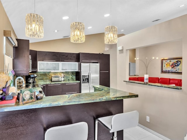 457 Cambridge Dr, Weston, FL 33326 - kitchen featuring stainless steel refrigerator with ice dispenser, a chandelier, dark brown cabinetry, a peninsula, and recessed lighting