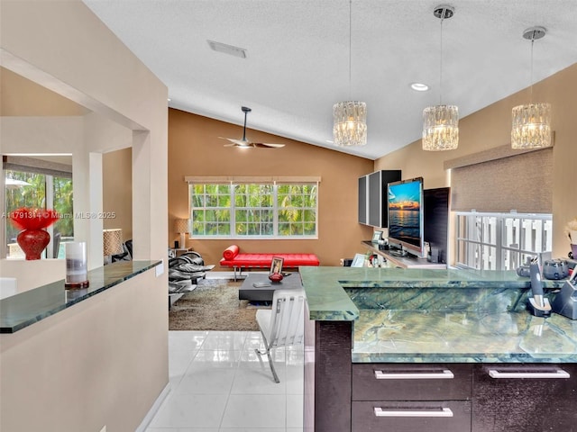 457 Cambridge Dr, Weston, FL 33326 - kitchen featuring vaulted ceiling, light tile patterned floors, pendant lighting, ceiling fan, and open floor plan