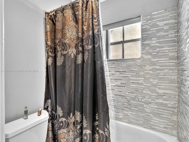 457 Cambridge Dr, Weston, FL 33326 - bathroom featuring shower / tub combo and toilet