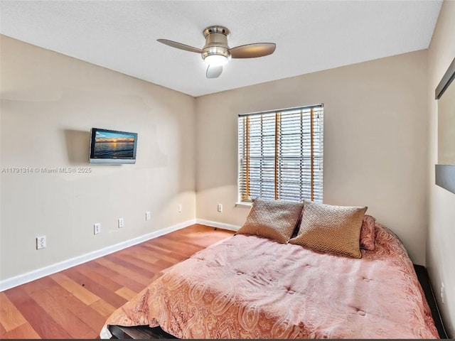 457 Cambridge Dr, Weston, FL 33326 - bedroom featuring wood finished floors and a ceiling fan