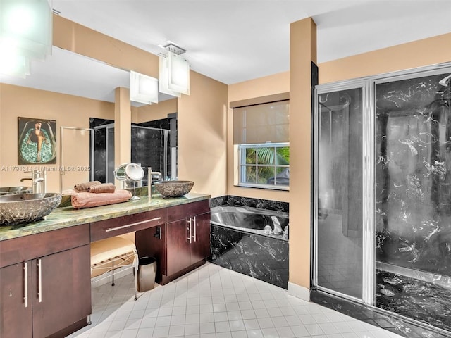 457 Cambridge Dr, Weston, FL 33326 - bathroom featuring double vanity, a garden tub, a shower stall, and tile patterned floors