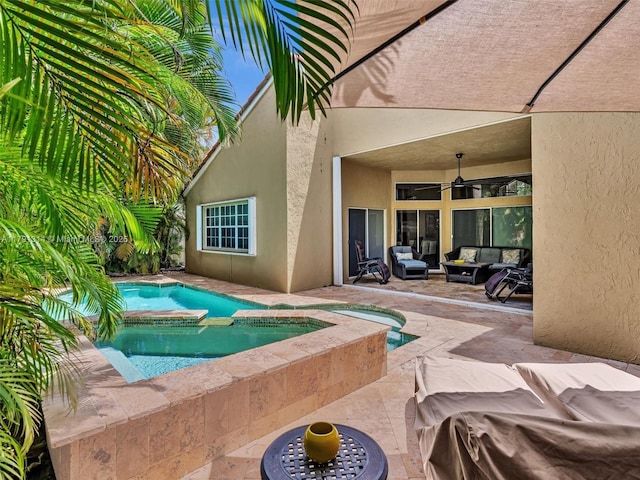 457 Cambridge Dr, Weston, FL 33326 - view of pool featuring an outdoor living space, ceiling fan, a patio, and a pool with connected hot tub