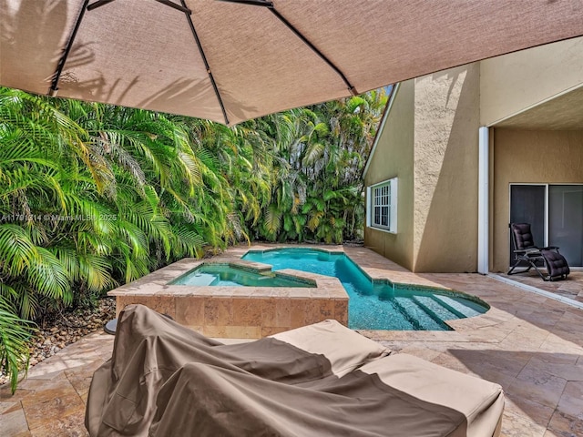 457 Cambridge Dr, Weston, FL 33326 - view of swimming pool featuring a patio and a pool with connected hot tub