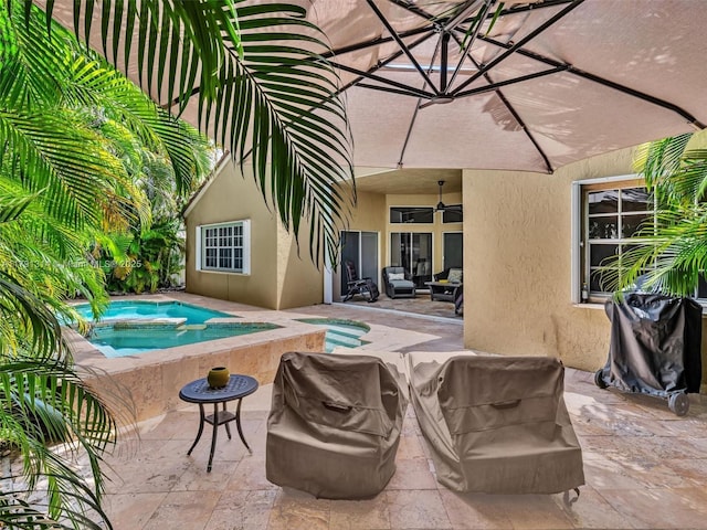 457 Cambridge Dr, Weston, FL 33326 - view of swimming pool featuring ceiling fan, a patio area, and a pool with connected hot tub