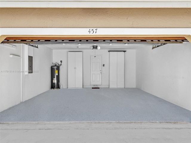 457 Cambridge Dr, Weston, FL 33326 - garage featuring electric water heater and electric panel