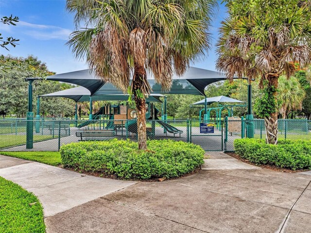 457 Cambridge Dr, Weston, FL 33326 - surrounding community featuring a gate