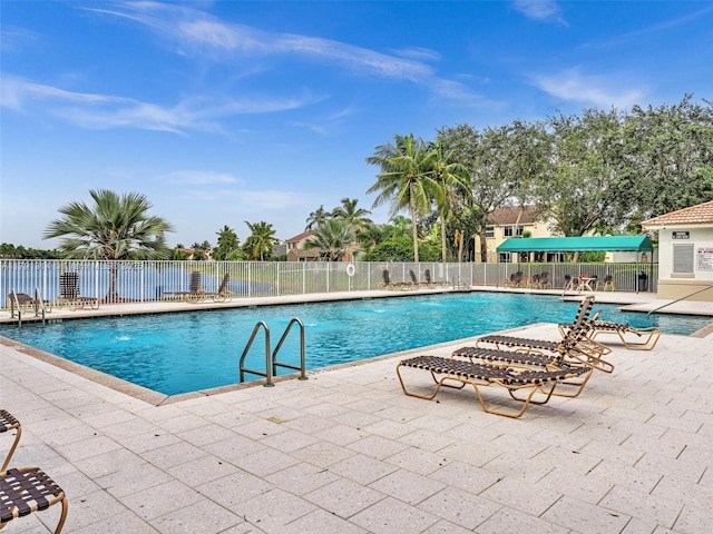 457 Cambridge Dr, Weston, FL 33326 - community pool with a patio area