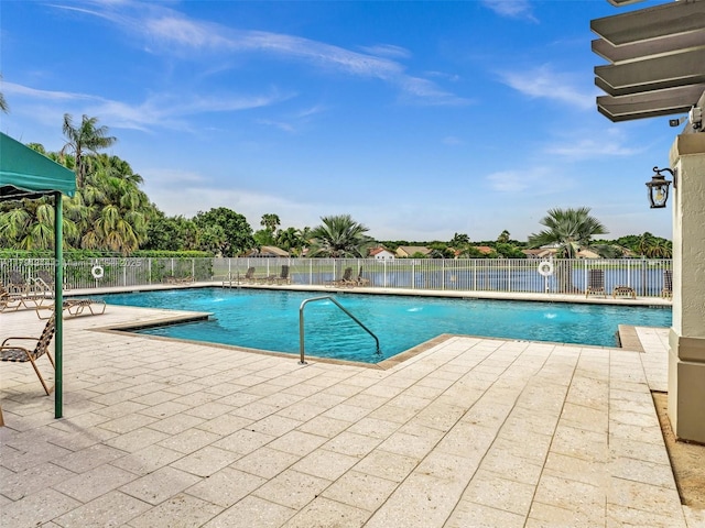 457 Cambridge Dr, Weston, FL 33326 - community pool featuring a patio area