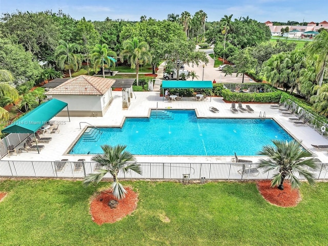 457 Cambridge Dr, Weston, FL 33326 - community pool featuring a patio and view of wooded area