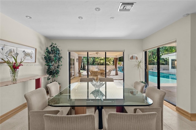 5465 Banyan Trl, Coral Gables, FL 33156 - dining space with light tile patterned flooring and baseboards