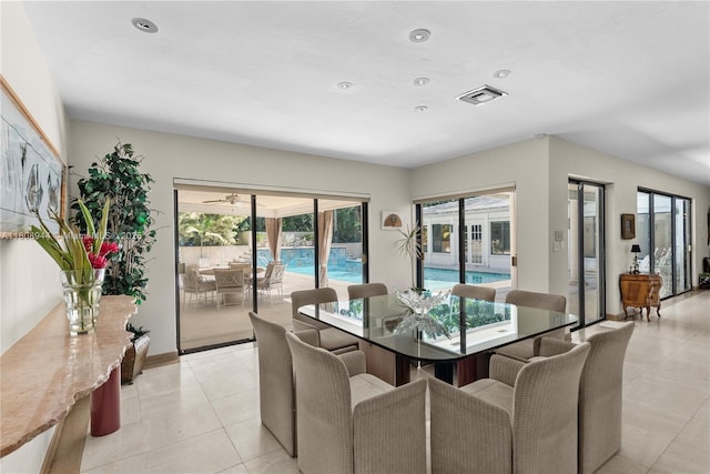 5465 Banyan Trl, Coral Gables, FL 33156 - dining room featuring light tile patterned flooring, recessed lighting, ceiling fan, and baseboards