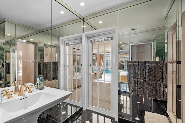 5465 Banyan Trl, Coral Gables, FL 33156 - bathroom with granite tiled floors, french doors, a sink, and recessed lighting