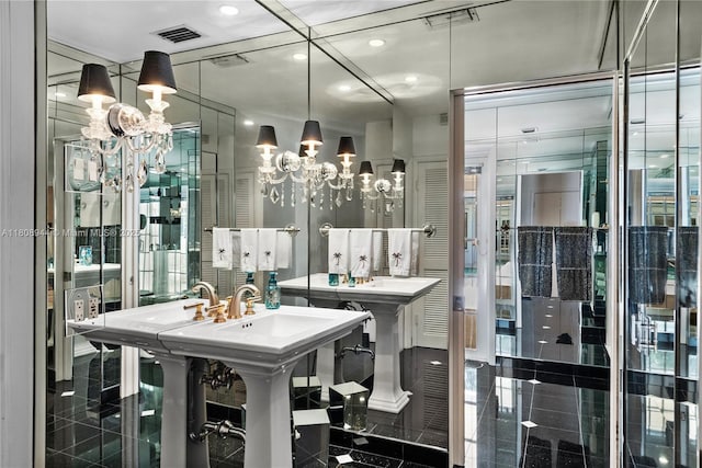 5465 Banyan Trl, Coral Gables, FL 33156 - bathroom featuring granite tiled floors, a chandelier, and recessed lighting