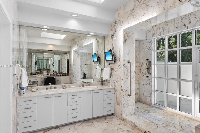 5465 Banyan Trl, Coral Gables, FL 33156 - bathroom featuring a marble finish shower, marble finish floors, a skylight, and double vanity