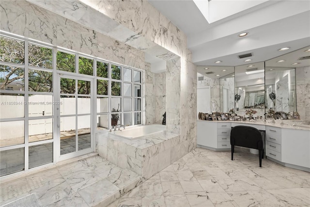 5465 Banyan Trl, Coral Gables, FL 33156 - bathroom with vanity, a bath, marble tiled floors, a skylight, and recessed lighting