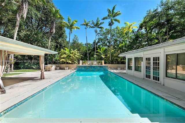5465 Banyan Trl, Coral Gables, FL 33156 - view of pool with a patio, french doors, a fenced backyard, and view of scattered trees