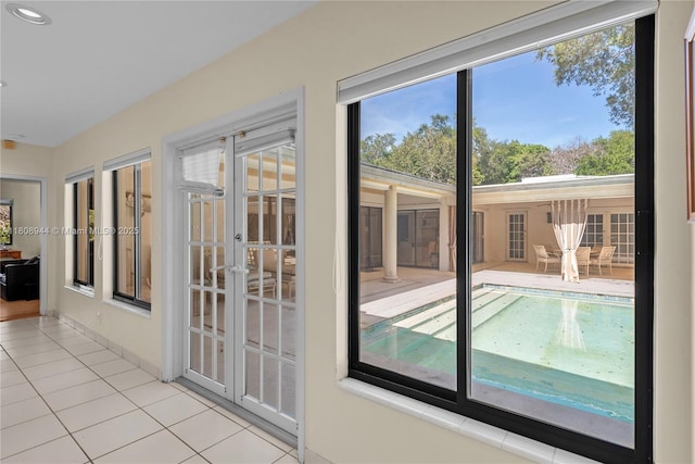 5465 Banyan Trl, Coral Gables, FL 33156 - unfurnished sunroom featuring french doors and plenty of natural light