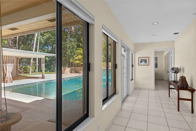 5465 Banyan Trl, Coral Gables, FL 33156 - hall with light tile patterned floors, baseboards, and recessed lighting