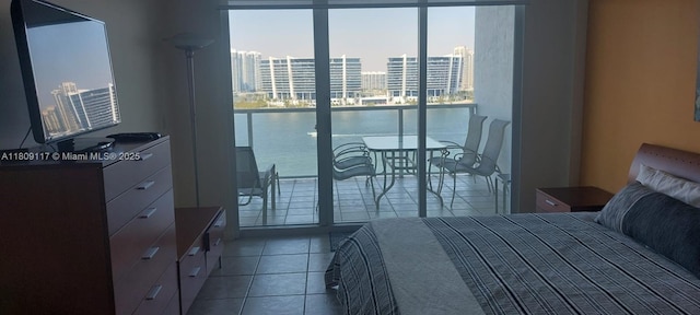 18100 N Bay Rd Unit Ph7, Sunny Isles Beach, FL 33160 - tiled bedroom with expansive windows, a city view, and a water view
