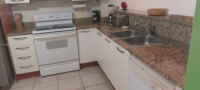 18100 N Bay Rd Unit Ph7, Sunny Isles Beach, FL 33160 - kitchen with white appliances, white cabinetry, and light tile patterned floors