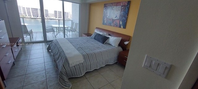 18100 N Bay Rd Unit Ph7, Sunny Isles Beach, FL 33160 - bedroom with a textured wall and light tile patterned floors