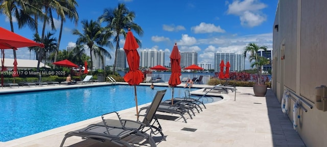18100 N Bay Rd Unit Ph7, Sunny Isles Beach, FL 33160 - community pool featuring a patio area and a skyline view