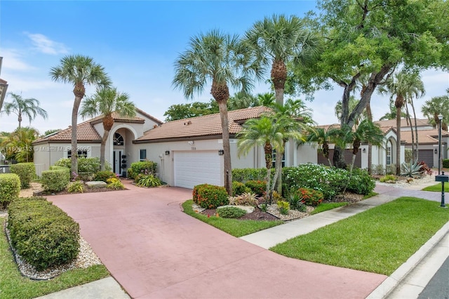 7259 Via Palomar, Boca Raton, FL 33433 - mediterranean / spanish house featuring concrete driveway, stucco siding, an attached garage, and a tiled roof