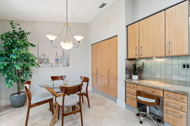 7259 Via Palomar, Boca Raton, FL 33433 - dining room with a chandelier, light tile patterned flooring, a desk, and baseboards