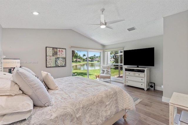 7259 Via Palomar, Boca Raton, FL 33433 - bedroom featuring vaulted ceiling, wood finished floors, a textured ceiling, baseboards, and ceiling fan