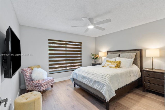 7259 Via Palomar, Boca Raton, FL 33433 - bedroom featuring wood finished floors, a textured ceiling, ceiling fan, and baseboards