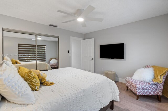 7259 Via Palomar, Boca Raton, FL 33433 - bedroom with wood finished floors, a closet, baseboards, and a ceiling fan