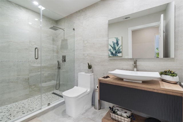 7259 Via Palomar, Boca Raton, FL 33433 - bathroom with a shower stall, tile walls, toilet, and vanity