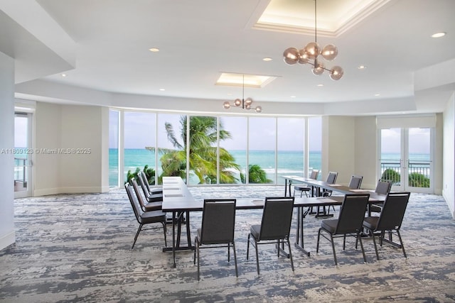 17375 Collins Ave Unit 1108, Sunny Isles Beach, FL 33160 - carpeted dining room featuring a chandelier, a water view, and recessed lighting