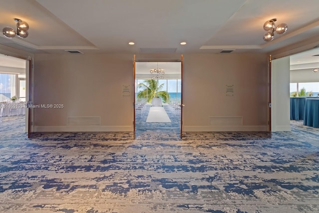 17375 Collins Ave Unit 1108, Sunny Isles Beach, FL 33160 - hallway with carpet floors, plenty of natural light, a tray ceiling, and recessed lighting
